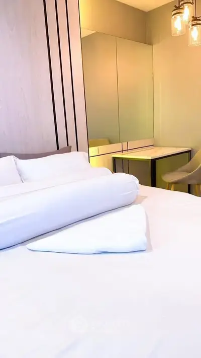 Modern bedroom with elegant lighting and cozy decor