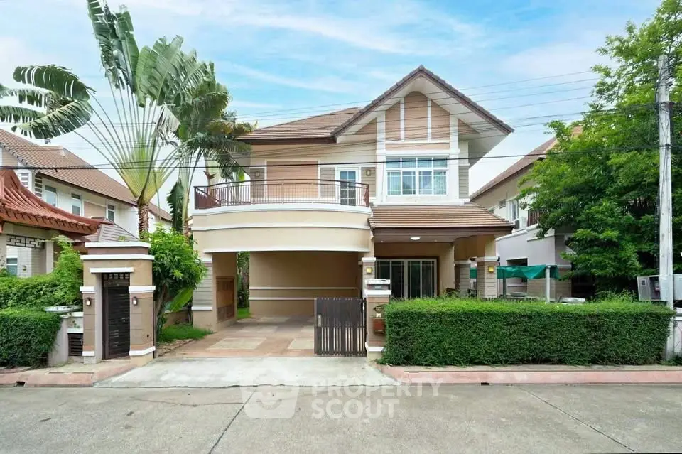 Charming two-story house with lush greenery and spacious driveway in a serene neighborhood.