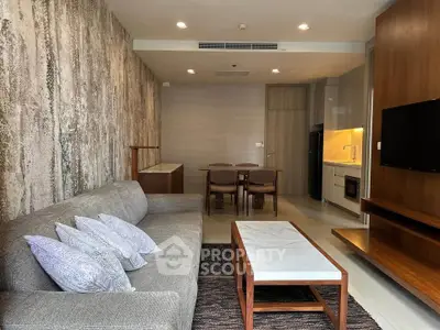 Modern living room with stylish decor and open kitchen layout
