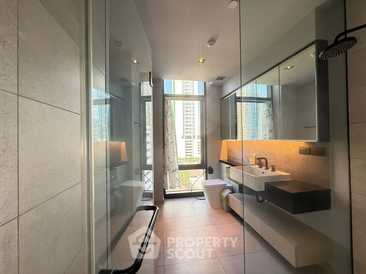 Luxurious modern bathroom with city view and sleek design