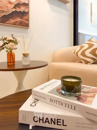 Stylish living room with modern decor and elegant coffee table books.