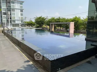 Luxurious condominium with stunning infinity pool and modern architecture.
