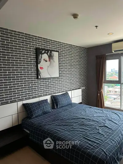 Modern bedroom with stylish brick accent wall and large window offering city views.
