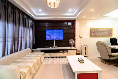 Spacious living room with modern decor and ample natural light