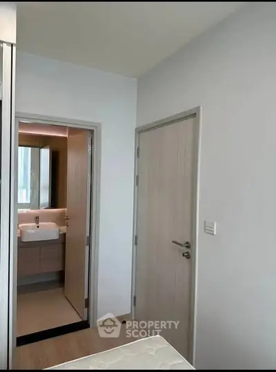 Modern bedroom with ensuite bathroom and sleek design