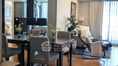 Stylish modern living room with elegant dining area and cozy seating, perfect for urban living.
