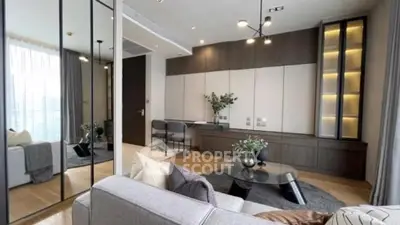 Modern living room with elegant decor and large windows for natural light