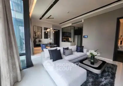 Luxurious modern living room with elegant decor and open layout, featuring stylish furniture and ambient lighting.