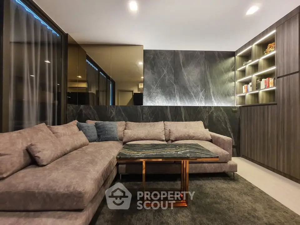 Luxurious modern living room with elegant sectional sofa and stylish shelving