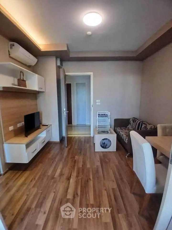 Modern living room with wooden flooring and stylish furniture