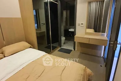 Cozy bedroom with ensuite bathroom and modern furnishings