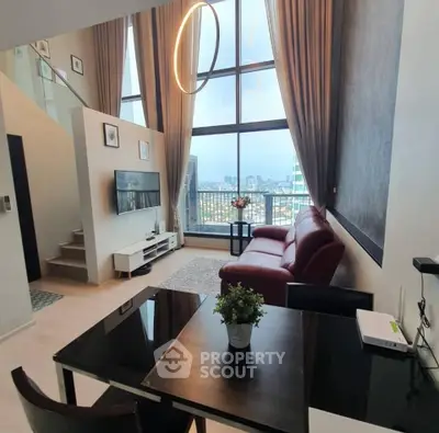 Luxurious modern living room with high ceilings and stunning city view