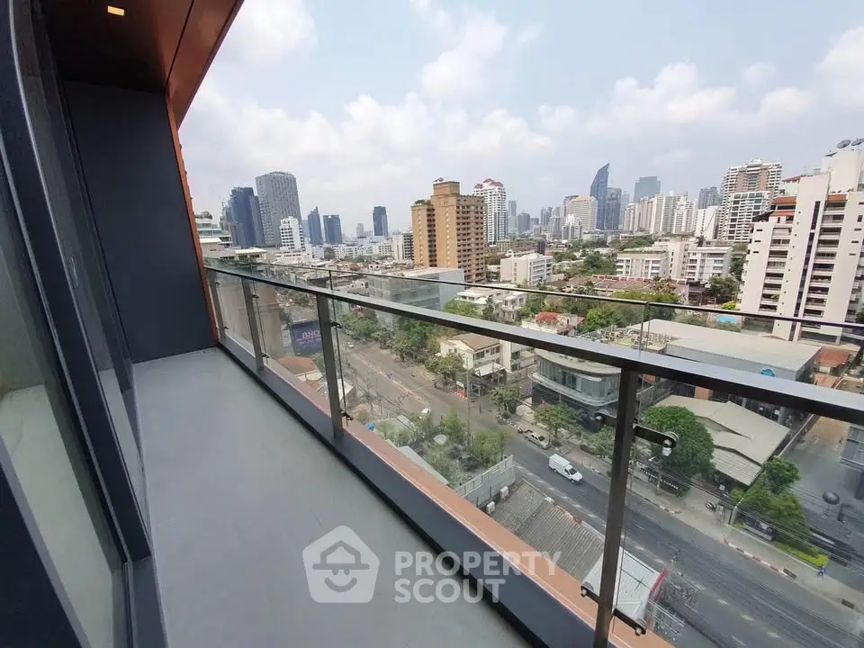 Stunning cityscape view from a modern high-rise balcony, perfect for urban living.
