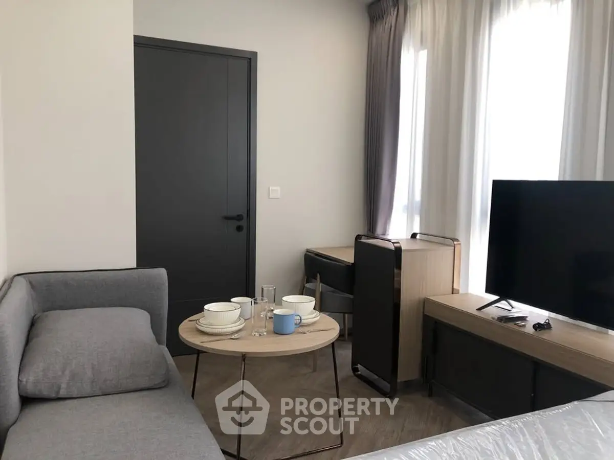 Modern living room with sleek furniture and natural light