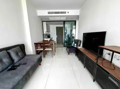 Modern living room with sleek furniture and open layout in a contemporary apartment.