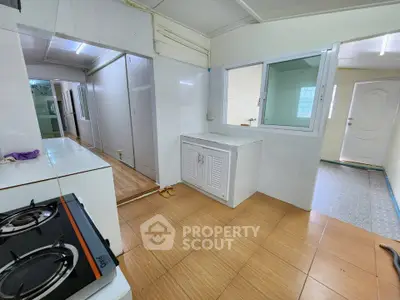 Spacious kitchen with gas stove and ample storage in modern home