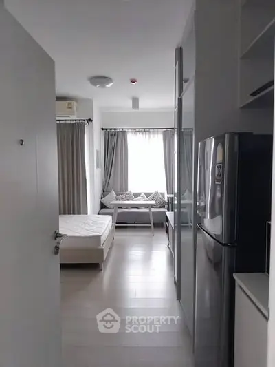 Modern studio apartment with sleek design and natural light