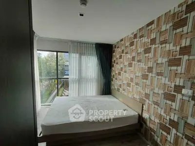 Modern bedroom with large window and stylish wood-patterned accent wall