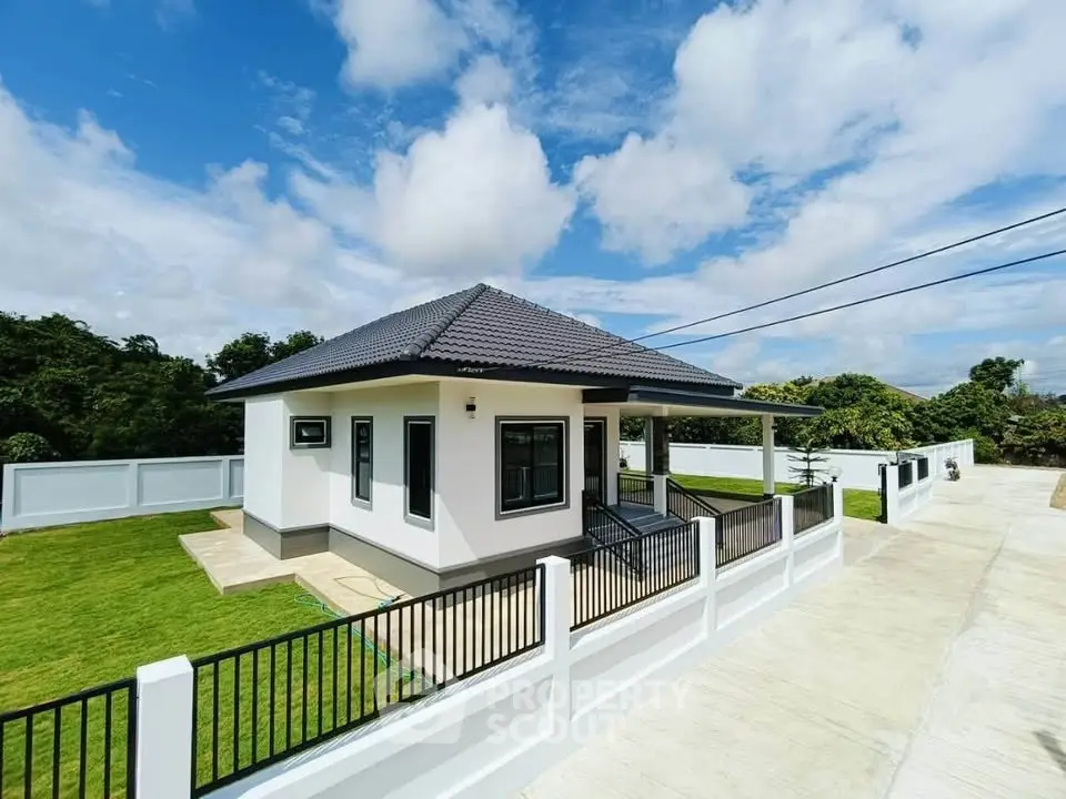 Charming modern house with spacious yard and sleek design, perfect for family living.