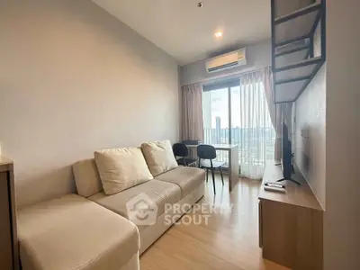 Modern living room with city view, featuring cozy sofa and stylish decor.