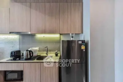 Modern kitchen with sleek cabinetry and stainless steel appliances