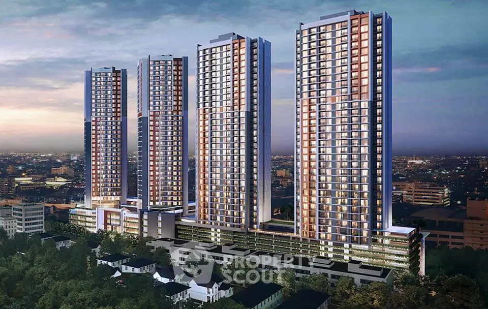 Stunning high-rise residential towers with panoramic city views at dusk.