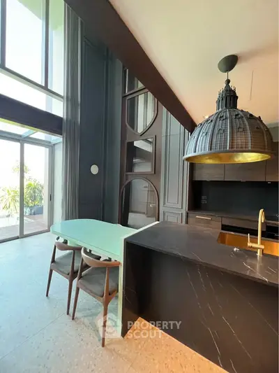 Luxurious modern kitchen with high ceilings and elegant design