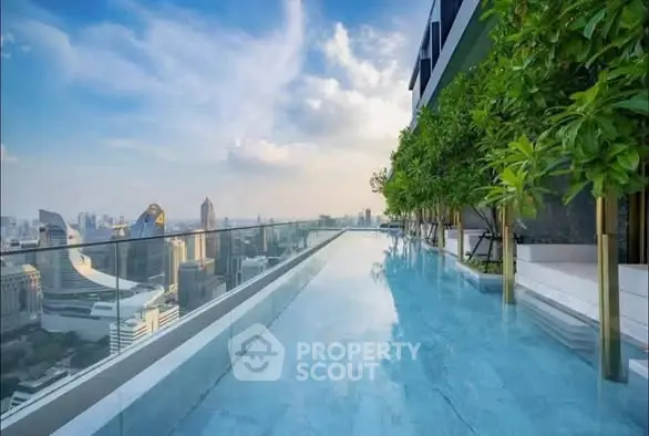 Luxurious rooftop pool with stunning city skyline view, perfect for urban living enthusiasts.