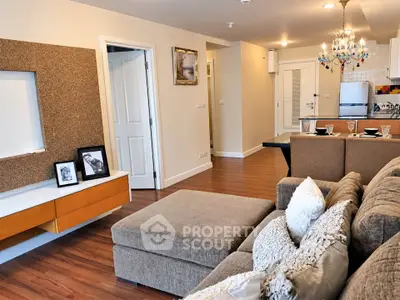 Spacious modern living room with elegant decor and open kitchen layout