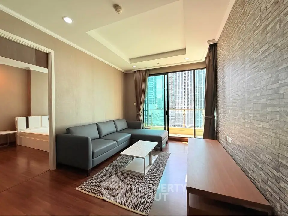 Modern living room with sleek furniture and city view, featuring a spacious layout and stylish decor.
