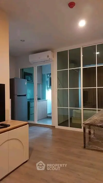Modern apartment interior with open layout and sleek kitchen design