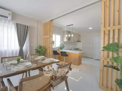 Modern dining area with open kitchen and stylish wooden accents