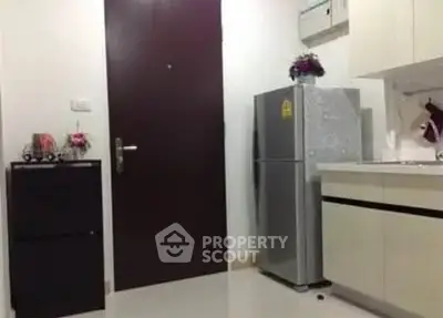 Modern kitchen with sleek fridge and minimalist decor