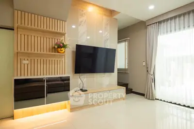 Modern living room with sleek TV setup and elegant decor