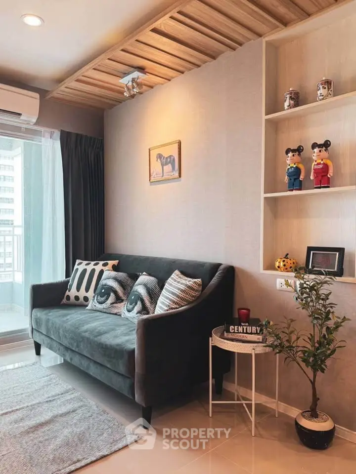 Stylish living room with modern decor and cozy sofa in a high-rise apartment.