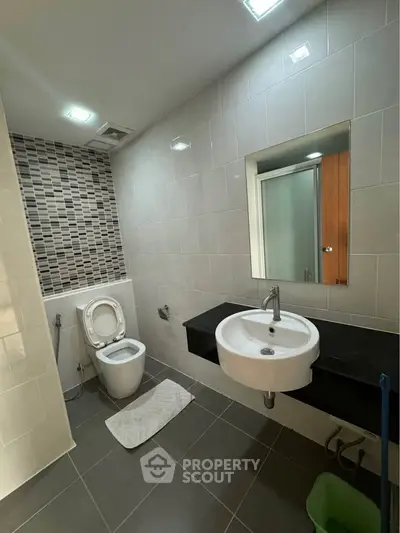 Modern bathroom with sleek fixtures and stylish tile accents