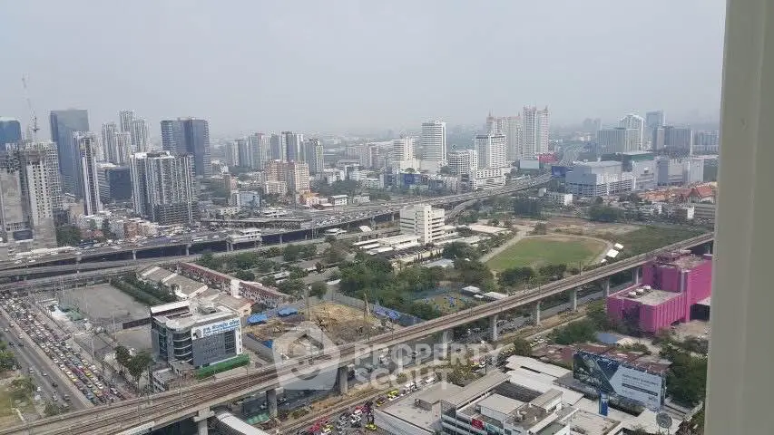 Stunning cityscape view from high-rise building showcasing urban skyline and infrastructure.