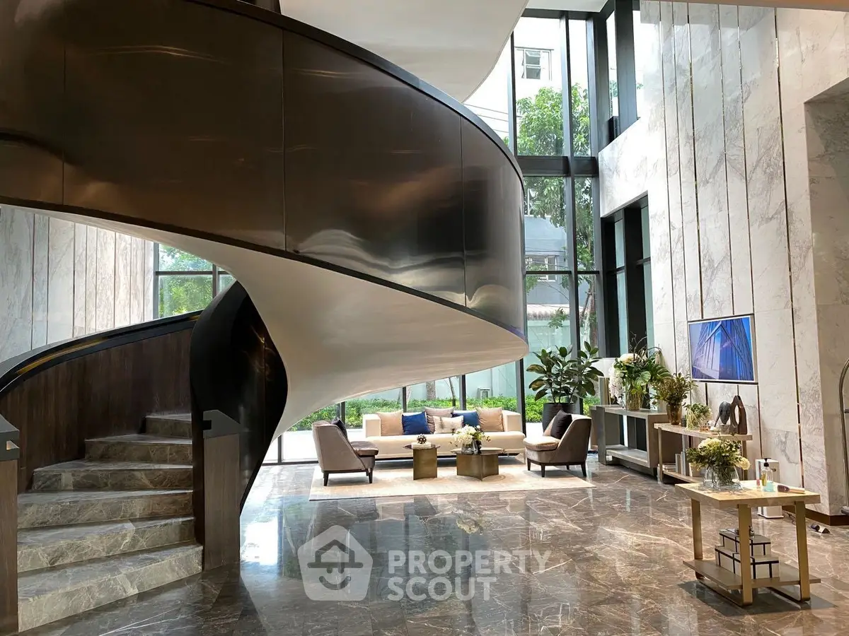 Luxurious modern living room with spiral staircase and elegant decor