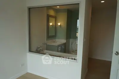 Modern bathroom with large glass window and stylish fixtures