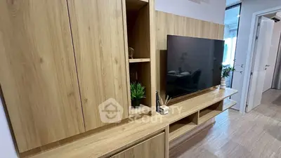 Modern living room with sleek wooden TV unit and stylish decor
