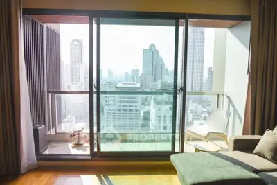 Luxurious high-rise apartment with stunning city view from spacious balcony.