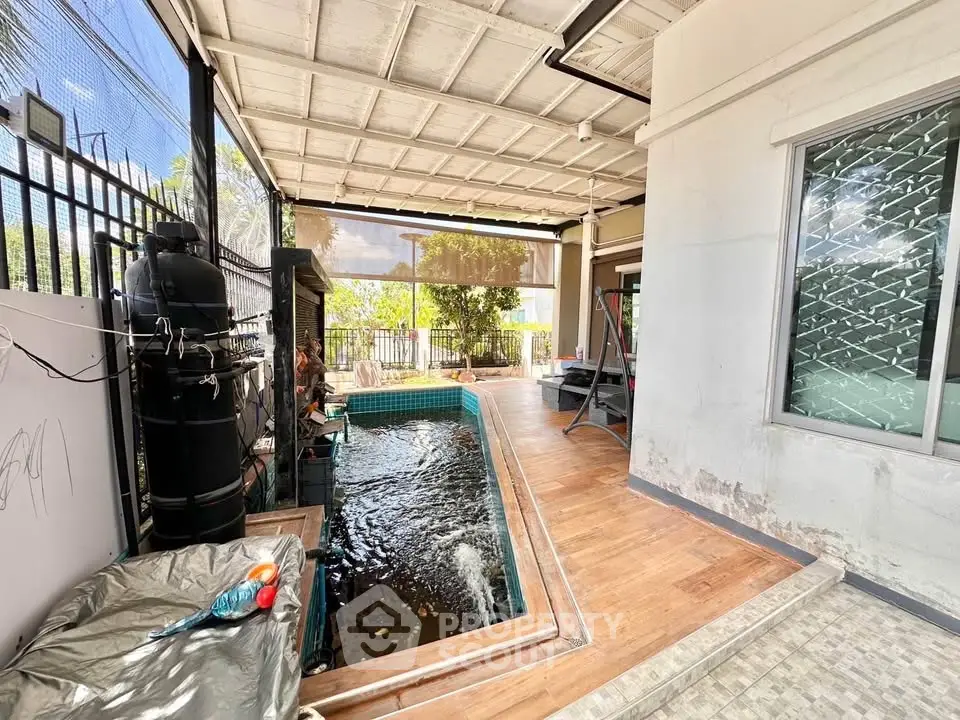 Spacious outdoor area with a private pool and garden view, perfect for relaxation and entertainment.
