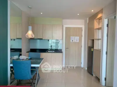 Modern compact kitchen with dining area in stylish apartment