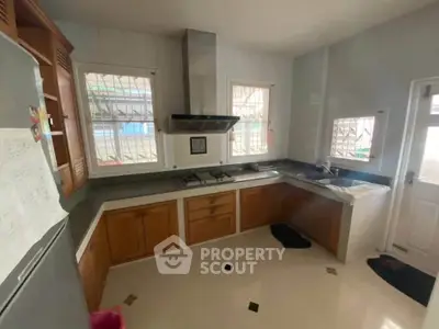 Spacious kitchen with modern appliances and ample natural light