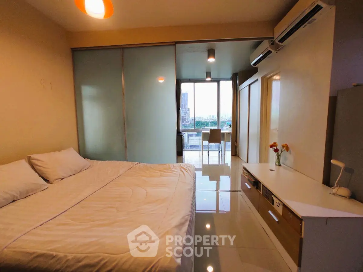 Modern bedroom with balcony view and sleek interior design