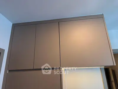 Modern kitchen cabinet with sleek design and ample storage space.