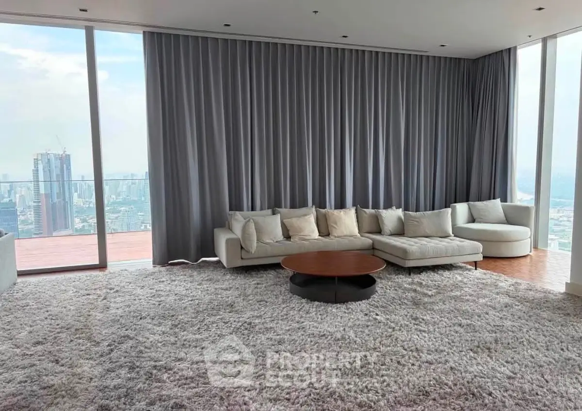 Luxurious living room with panoramic city view and plush carpet