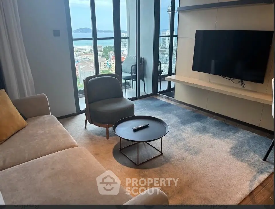 Modern living room with stunning city view and balcony access