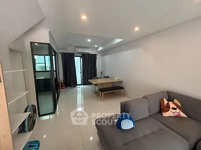 Spacious modern living room with sleek design and ample natural light