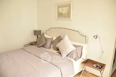 Cozy and elegant bedroom with stylish decor and soft lighting, perfect for relaxation.